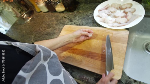 Housewife cooking fish stew at home. High quality 4k footage