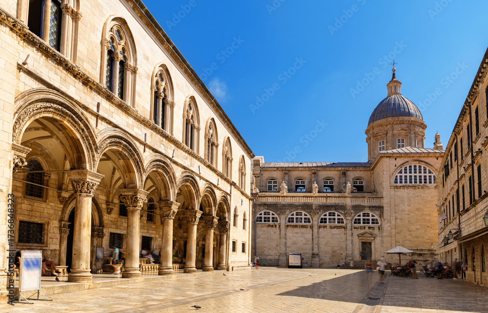 Fototapeta premium Courtyard and portal of palace in Dubrovnik is old building in Gothic style, city museum. Location of government agencies and Government during Ragusa period