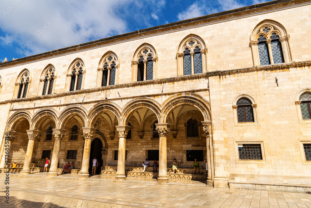 Fototapeta premium Courtyard and portal of palace in Dubrovnik is old building in Gothic style, city museum. Location of government agencies and Government during Ragusa period