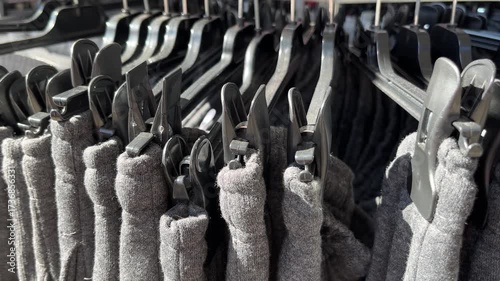 Gray Trousers Displayed on Hangers in Market