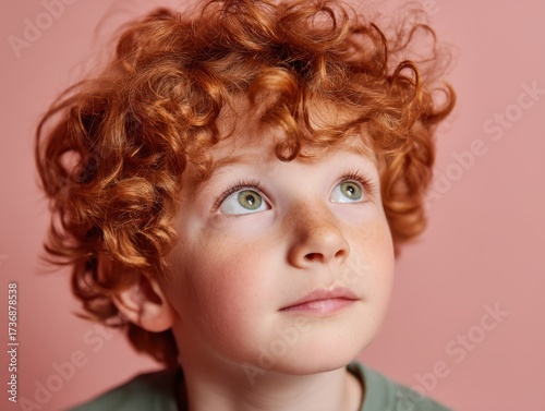 Curly-haired child with a t...