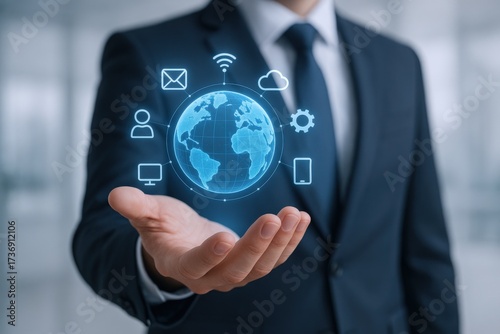 Wallpaper Mural Global Network Technology: Businessman Holding Holographic Earth with Digital Communication Icons Represents International Business and Connectivity Torontodigital.ca