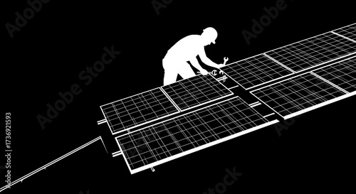 Silhouette of a worker in a hard hat installing solar panels on a dark background with a wrench in hand