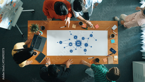 Quadro su tela Collaborative Management Session with Strategic Planning and Visual Diagrams on a Conference Table with Diverse Team Members