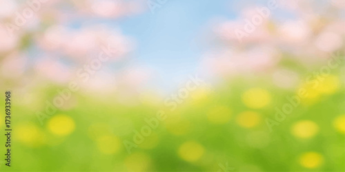 Soft natural sunlight creates an abstract green and bright spring bokeh texture with a blurred grass and leaf pattern