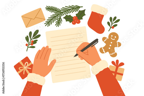 Hands writing a Christmas letter to Santa Claus. Top view of a festive holiday desk with a wish list, envelope, gift boxes, gingerbread man, stocking, fir, and holly berries. Xmas eve concept.