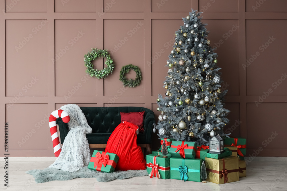 Obraz premium Interior of living room with sofa, Santa bag and Christmas tree