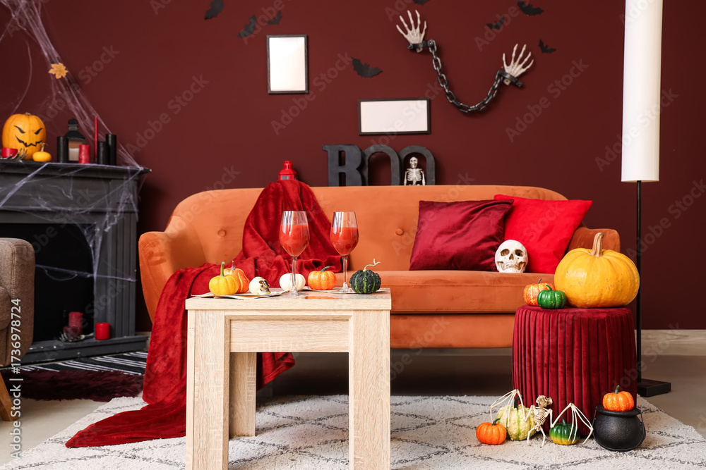 Fototapeta premium Interior of living room decorated for Halloween with sofa, table and pumpkins