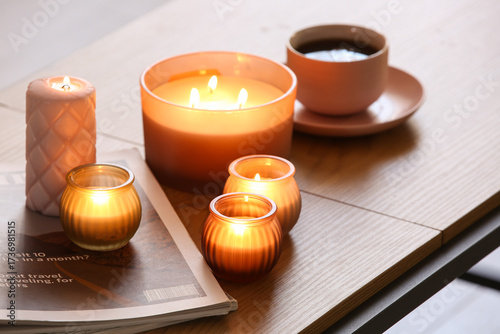 Magazines and burning candl...