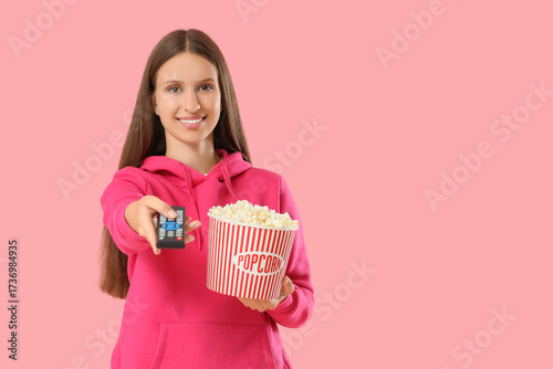 Young woman with remote con...