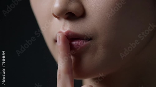 Silence gesture extreme close up female