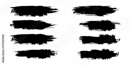 Collection of eight black ink brush stroke textures on a white background for design elements