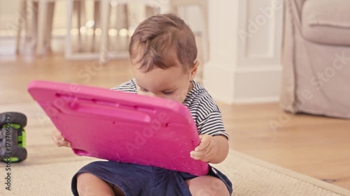 Infant Playing with iPad on Floor Lifestyle Stock Video
