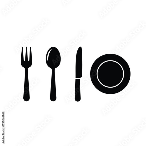 Set of fork, spoon, knife, and plate on a white background