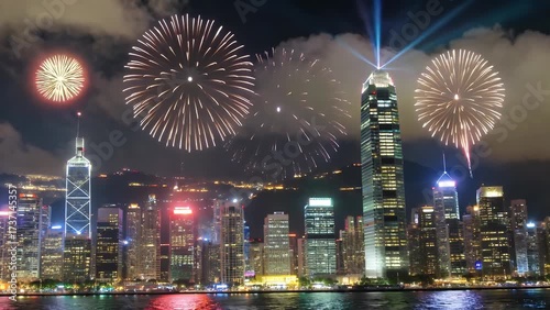 panoramic view of densely built-up metropolitan area illuminated at night reflected on the water with laser displays