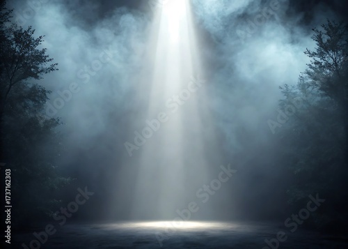 Mysterious bright beam of light illuminates foggy forest at night