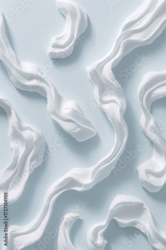 Abstract White Swirls on Light Blue: A captivating pattern of delicate, swirling white forms dances across a serene, light blue expanse, creating an impression of elegance and calm.