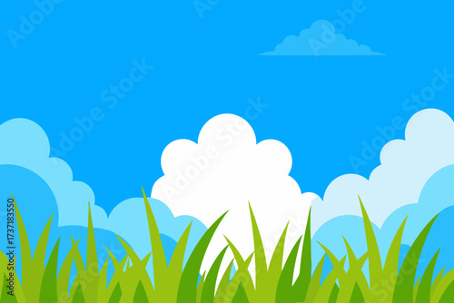 Vibrant green grass and fluffy white clouds against a bright blue sky