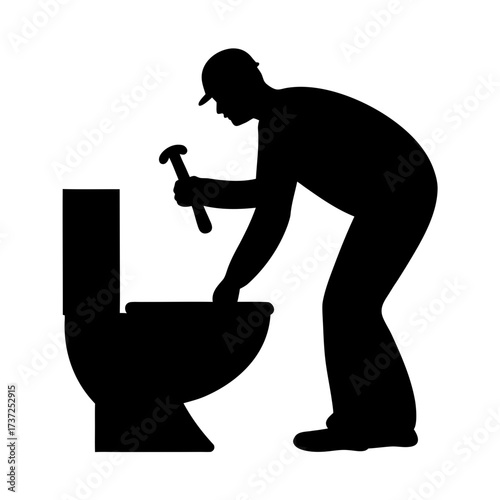 Plumber repairing a toilet in silhouette