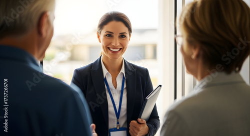 Professionalism and Trust A female insurance agent meeting with clients offering personalized financial advice and building strong relationships in home enviroment concept