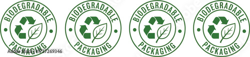Four Green Biodegradable Packaging Icons with Recycle Logo and Leaf