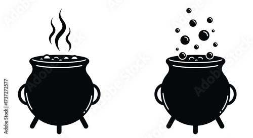 Two black cauldrons bubbling with a mysterious dark potion brew