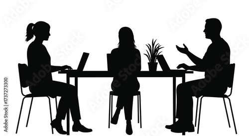 Silhouettes of people at a table having a business discussion