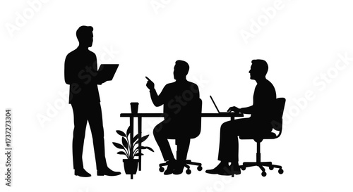 Business professionals in a meeting one standing and presenting to the team