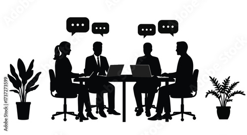 Business meeting with four people discussing ideas around a table