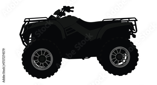 Silhouetted all terrain vehicle with large tires and handlebar detail