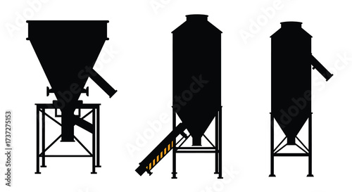 Silhouettes of industrial storage silos and hoppers in a linear arrangement