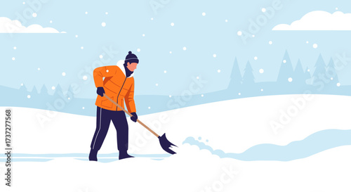 Man shoveling snow on a winter day with snow falling.
