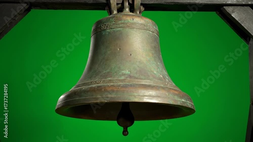 An old church bell ringing with a deep, resonating sound, isolated on solid green background historical, town, object
