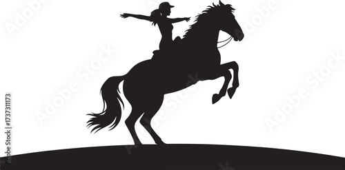Black silhouette of a woman in a baseball cap riding a rearing horse with arms outstretched rider