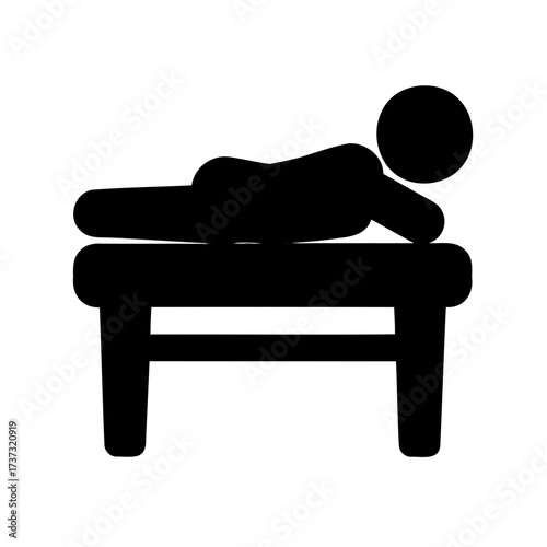 Person lying on a table receiving a massage, therapy, or treatment