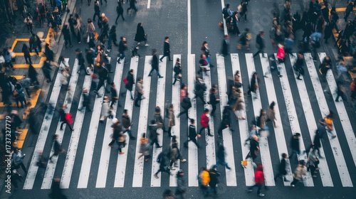 A vibrant city scene showcasing diverse individuals crossing a busy intersection, representing urban life.