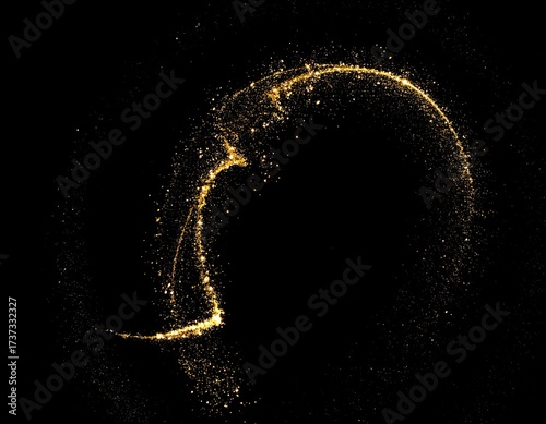 Golden, sparkling dust trail against black background