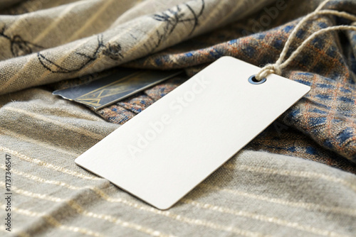 Blank White Rectangular Hang Tag Mockup on Luxury Woven Wool Fabric and Plaid Scarf