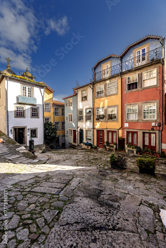 Colourful houses at a small square in the old town of Porto, Portugal.