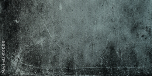 A wall textured surface, characterized by a deep gray color with varying shades, The surface is heavily textured with fine scratches, scuffs, and a mottled, worn-out appearance.