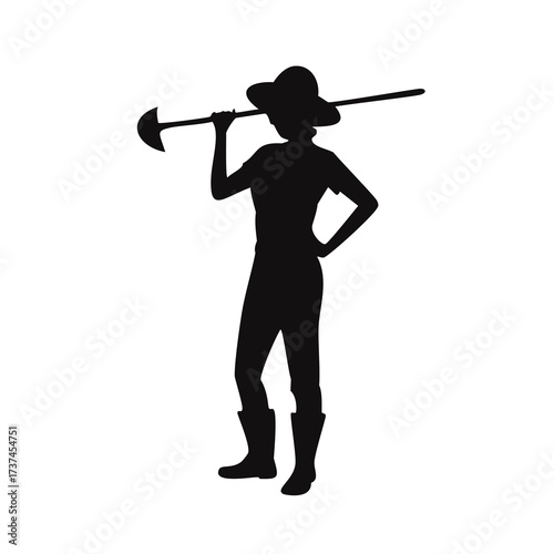 Silhouette of a woman with a hoe over her shoulder