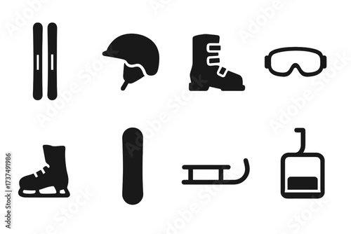 Winter sports gear includes skis, helmets, boots, skates, snowboards, and sleds for outdoor fun in snowy landscapes