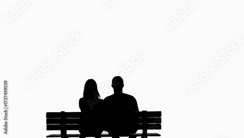 Romantic silhouette of couple sitting on park bench, enjoying a quiet moment together in peaceful solitude