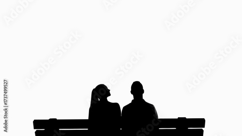 Silhouette of couple sitting together on a park bench, enjoying peaceful moment, love, romance, togetherness