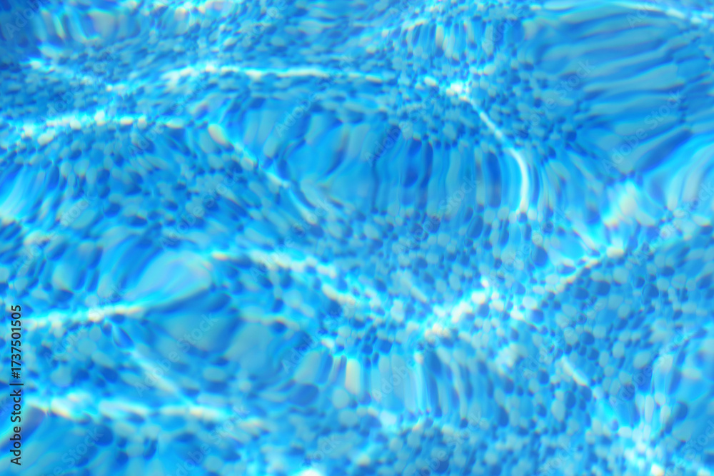 Obraz premium blue water ripples on swimming pool background 