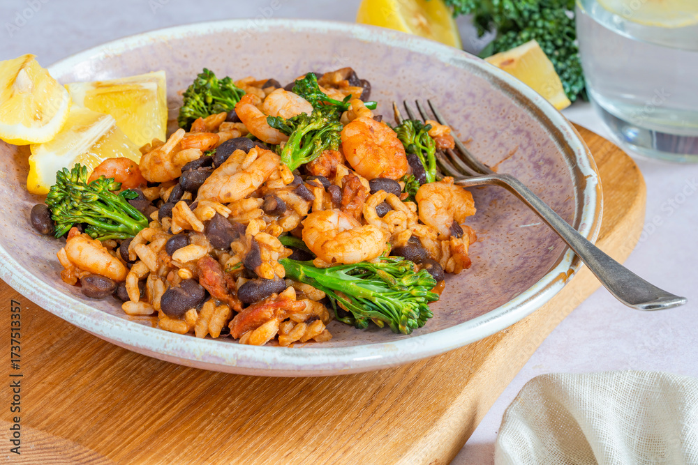 Fototapeta premium Chorizo and prawns rice with tenderstem broccoli
