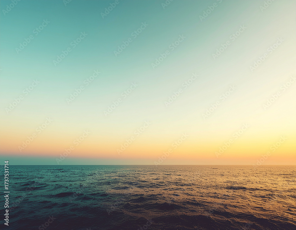 Obraz premium Ocean Horizon with Warm Sunset Gradient Sky – Minimalist Scenic Seascape Background