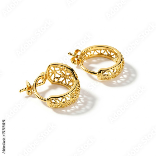 Gold filigree hoop earrings on white background gold earrings