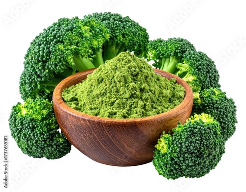 Broccoli florets surround a wooden bowl filled with green powder on a black background