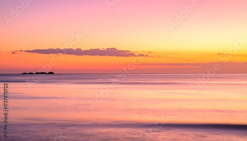 Colorful Ocean Sunset with Orange and Pink Sky Reflecting on Water